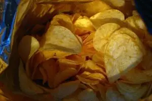 Close-up shot inside an open bag of potato chips