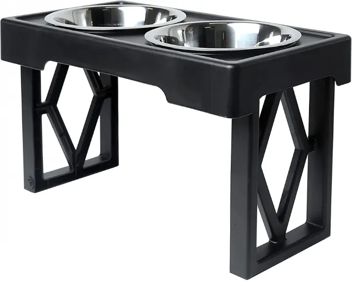 A black elevated pet feeder with two metal bowls