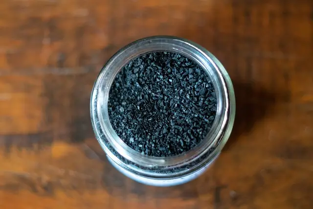Activated charcoal in a glass jar